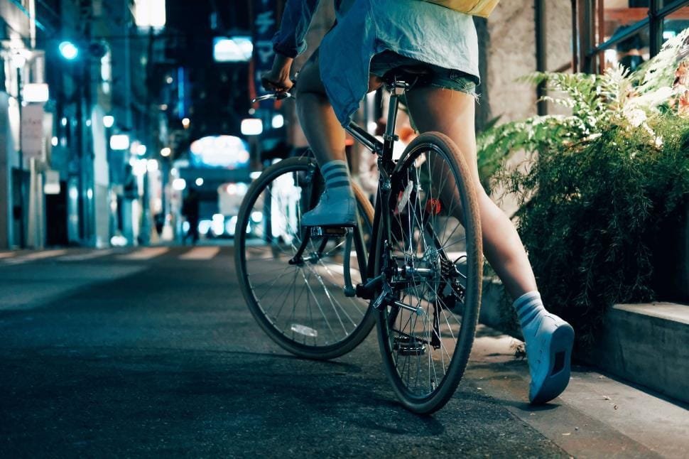 Cyclist in the city at night